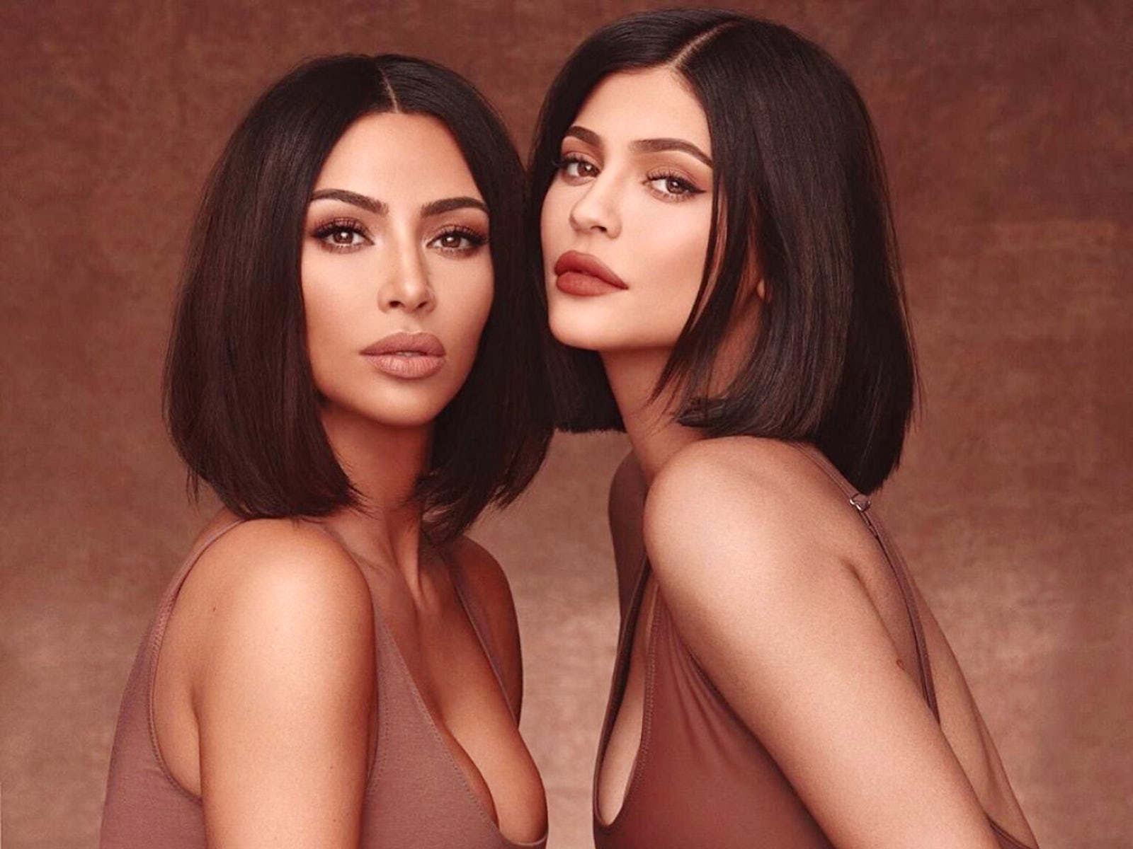 Kim Kardashian and Kylie Jenner wear matching looks in makeup promo